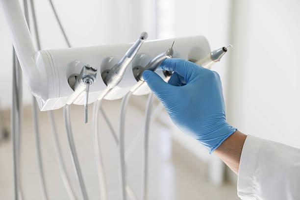 Professional Root Canal Treatment technician working in Old Bethpage, NY